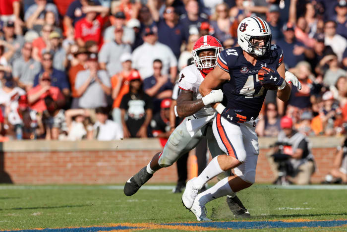 Oct 9, 2021; Auburn, Alabama, USA; Auburn Tigers tight end John Samuel Shenker (47) is tackled by Georgia Bulldogs linebacker Quay Walker (7) during the second quarter at Jordan-Hare Stadium. Mandatory Credit: John Reed-USA TODAY Sports